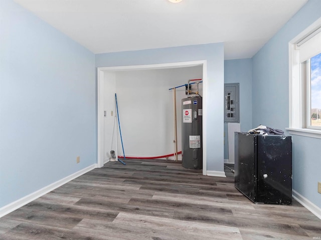 utility room with electric water heater and electric panel