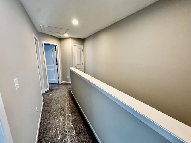 hallway featuring baseboards