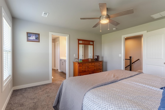 bedroom with visible vents, carpet flooring, baseboards, and multiple windows