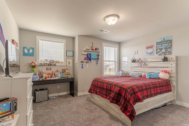 bedroom featuring carpet, visible vents, and baseboards