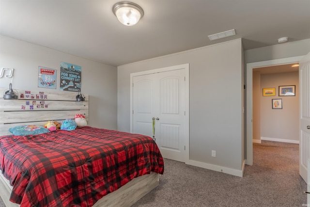 carpeted bedroom with visible vents and baseboards