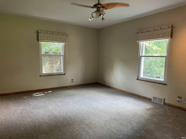 6065 Gladden Dr, Indianapolis, IN 46220 - carpeted empty room with baseboards, a ceiling fan, and visible vents