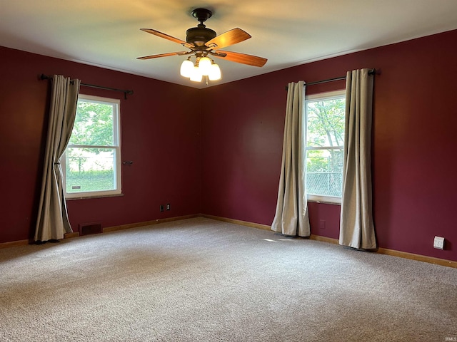6065 Gladden Dr, Indianapolis, IN 46220 - unfurnished room featuring baseboards, a ceiling fan, visible vents, and carpet