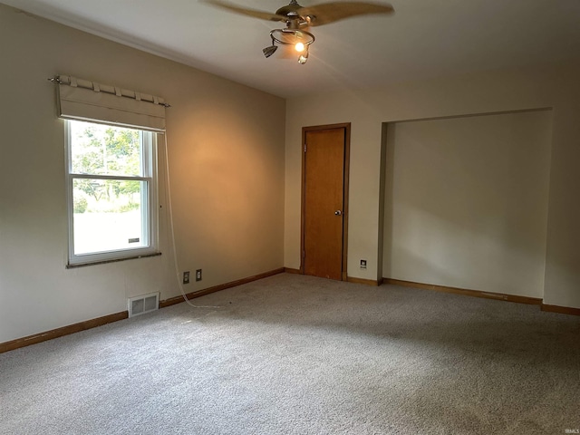 6065 Gladden Dr, Indianapolis, IN 46220 - empty room featuring baseboards, visible vents, carpet, and ceiling fan