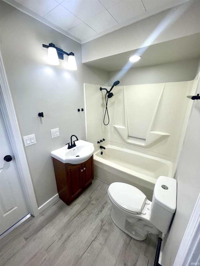 318 W 10th St, Bicknell, IN 47512 - bathroom featuring wood finished floors, toilet, shower / tub combination, and vanity