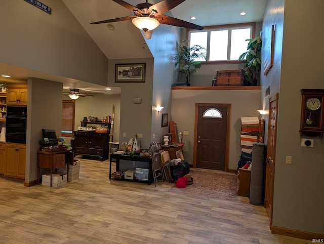 entrance foyer with light wood-style flooring, high vaulted ceiling, recessed lighting, and ceiling fan