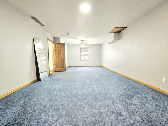 empty room with light colored carpet, ceiling fan, baseboards, and visible vents