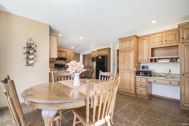 dining space featuring recessed lighting, baseboards, and built in desk