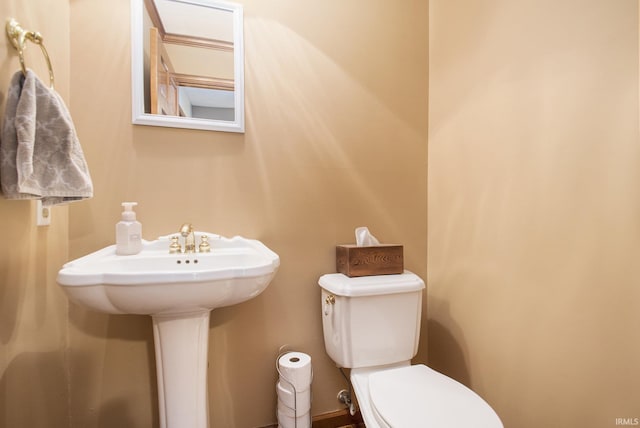half bath featuring toilet