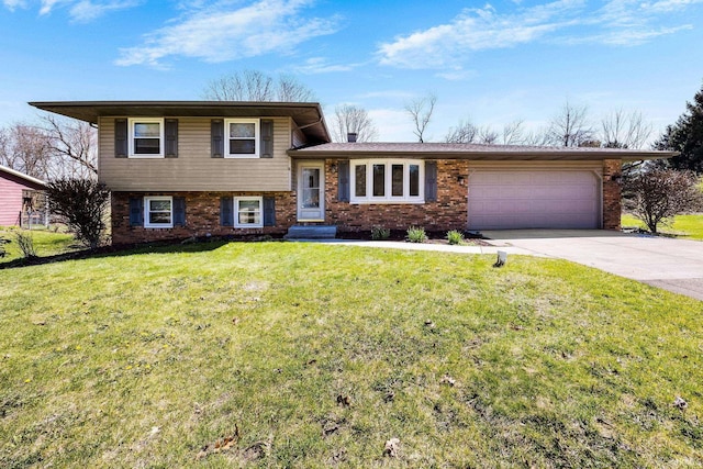tri-level home featuring an attached garage, a front lawn, driveway, and brick siding