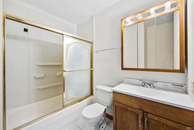 bathroom featuring tile patterned flooring, vanity, toilet, and bath / shower combo with glass door