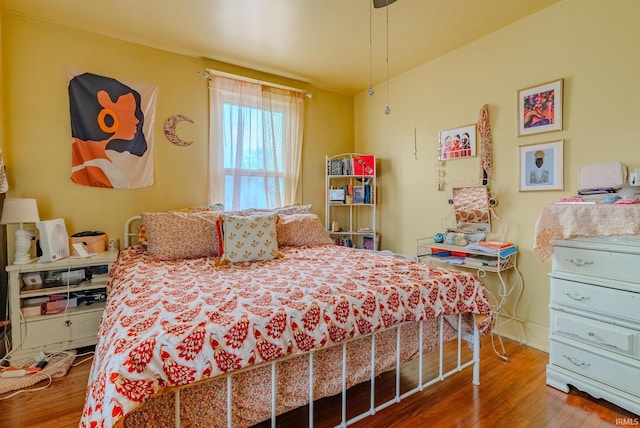 bedroom with wood finished floors