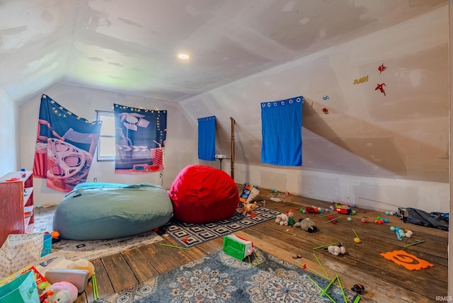 game room with hardwood / wood-style floors and lofted ceiling