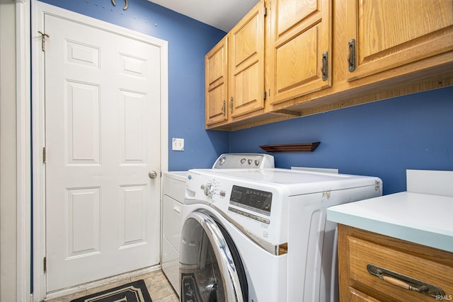 22486 Fireside Dr, Goshen, IN 46528 - laundry room with cabinet space and washing machine and clothes dryer