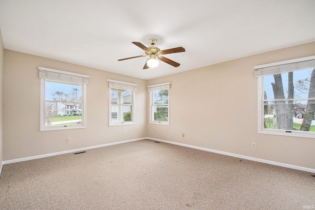 22486 Fireside Dr, Goshen, IN 46528 - unfurnished room featuring visible vents, carpet flooring, baseboards, and ceiling fan