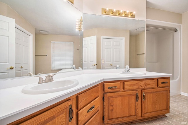 22486 Fireside Dr, Goshen, IN 46528 - full bath with tile patterned floors, a sink, and double vanity