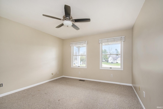 22486 Fireside Dr, Goshen, IN 46528 - carpeted spare room featuring baseboards, a ceiling fan, and visible vents
