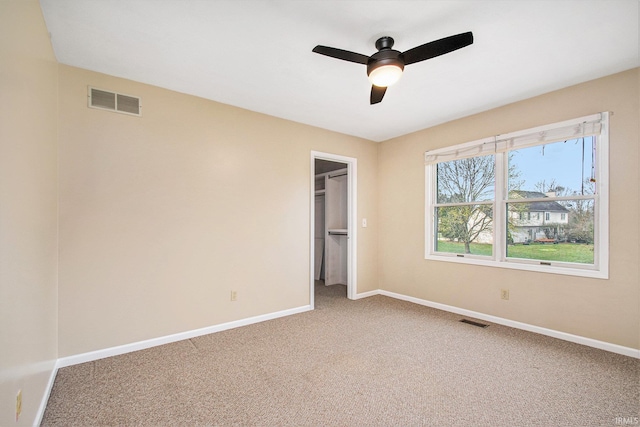 22486 Fireside Dr, Goshen, IN 46528 - unfurnished bedroom featuring a spacious closet, baseboards, visible vents, and carpet floors