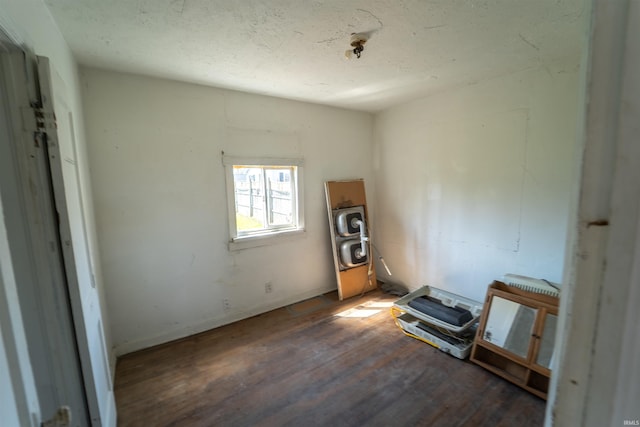 interior space with wood finished floors and baseboards
