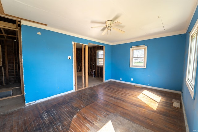 unfurnished bedroom with hardwood / wood-style flooring and baseboards