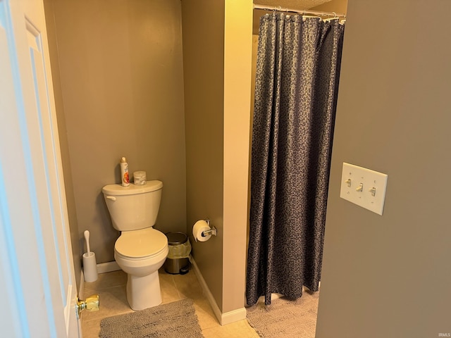 full bathroom with baseboards, toilet, tile patterned floors, and curtained shower