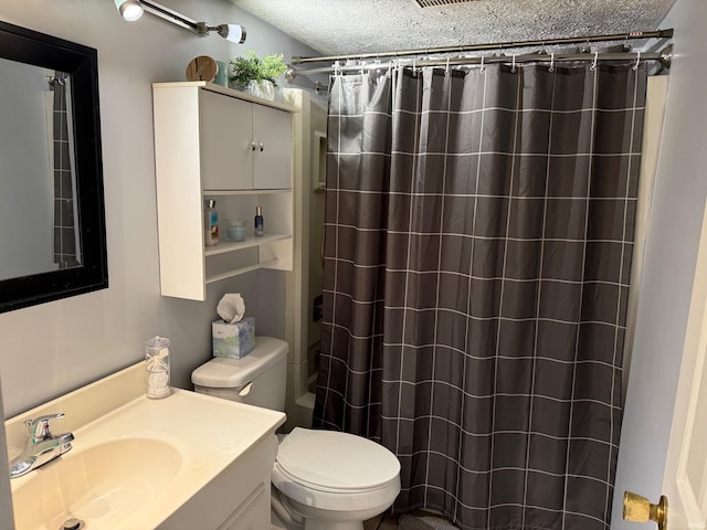 bathroom featuring toilet, a shower with curtain, vanity, and a textured ceiling