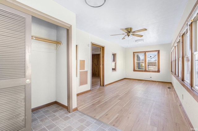 8763 E Backwater Rd, North Webster, IN 46555 - unfurnished bedroom with baseboards, a ceiling fan, visible vents, and a closet