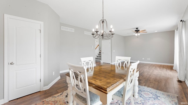 dining area with stairway, wood finished floors, visible vents, baseboards, and ceiling fan with notable chandelier