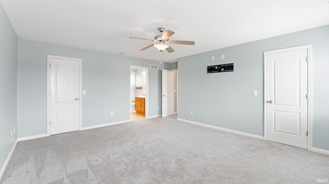 unfurnished bedroom featuring visible vents, baseboards, light carpet, and connected bathroom
