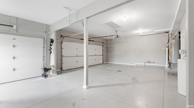 garage with gas water heater and a garage door opener