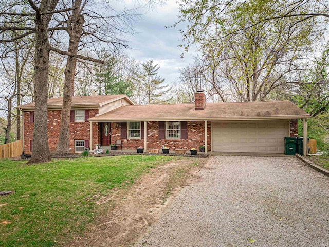 8013 Larch Ln, Evansville, IN 47710 - split level home with a chimney, a front lawn, an attached garage, driveway, and brick siding