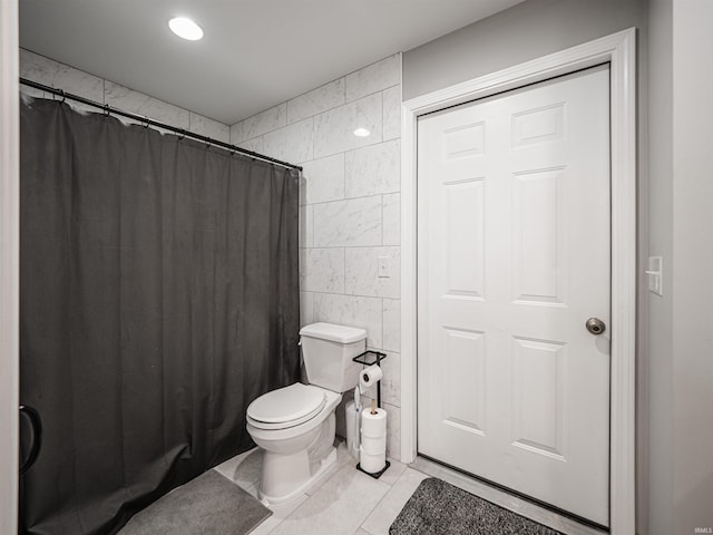 8013 Larch Ln, Evansville, IN 47710 - full bathroom with curtained shower, tile walls, tile patterned floors, and toilet