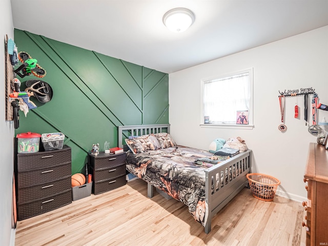8013 Larch Ln, Evansville, IN 47710 - bedroom featuring baseboards and wood finished floors