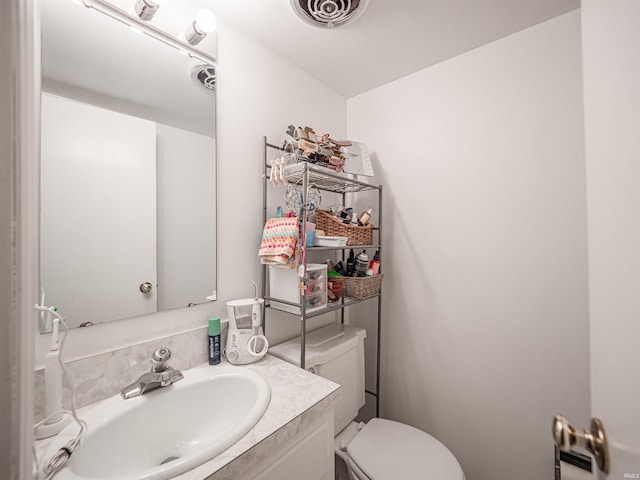 8013 Larch Ln, Evansville, IN 47710 - bathroom featuring visible vents, vanity, and toilet