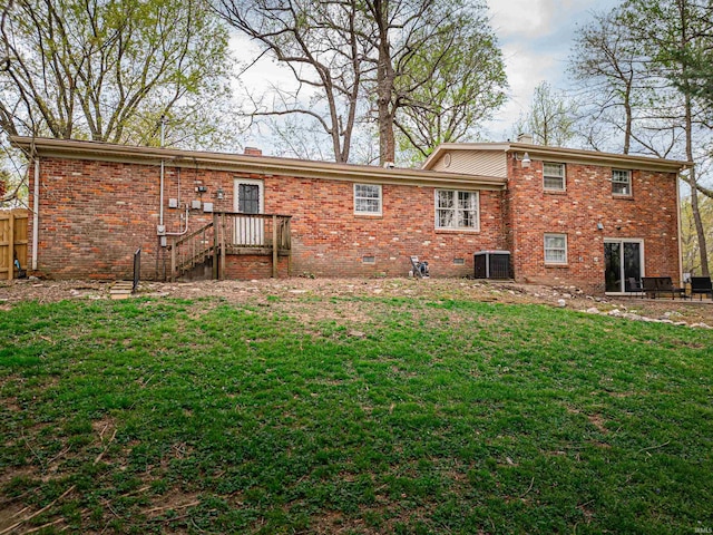 8013 Larch Ln, Evansville, IN 47710 - back of house with brick siding, a yard, central air condition unit, and fence