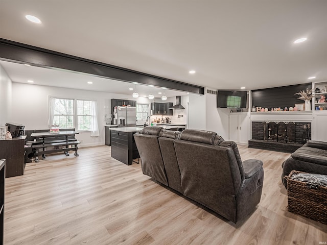 8013 Larch Ln, Evansville, IN 47710 - living room with recessed lighting, light wood-style flooring, a fireplace, and baseboards