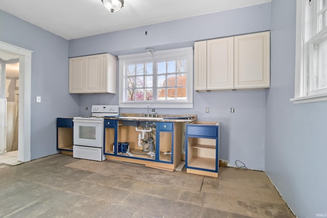 kitchen featuring electric stove and a sink