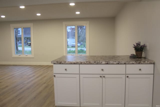 320 W Ritter St, Ellettsville, IN 47429 - kitchen featuring baseboards, recessed lighting, white cabinetry, and light stone counters