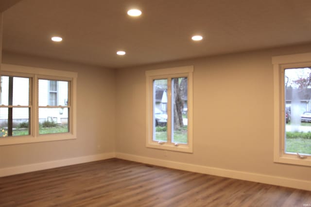 320 W Ritter St, Ellettsville, IN 47429 - empty room with baseboards, wood finished floors, and recessed lighting
