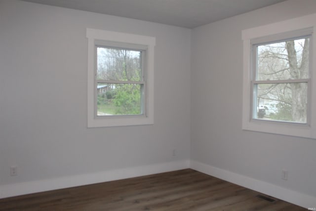 320 W Ritter St, Ellettsville, IN 47429 - spare room with dark wood finished floors, baseboards, and plenty of natural light