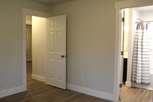 320 W Ritter St, Ellettsville, IN 47429 - unfurnished bedroom with wood finished floors and baseboards