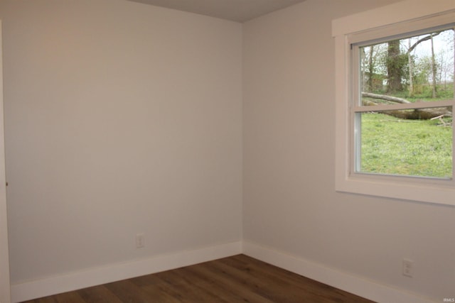 320 W Ritter St, Ellettsville, IN 47429 - unfurnished room featuring baseboards and dark wood-style floors