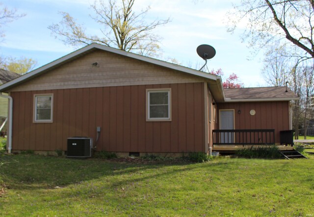 320 W Ritter St, Ellettsville, IN 47429 - view of home's exterior with a lawn, central AC, and a deck