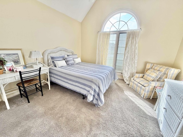 carpeted bedroom featuring vaulted ceiling