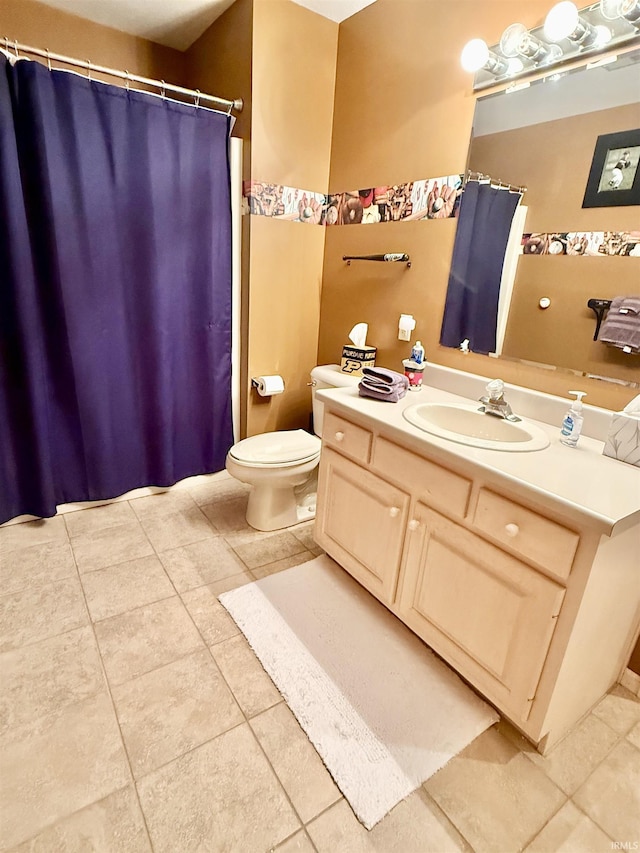 bathroom featuring a shower with curtain, tile patterned flooring, vanity, and toilet