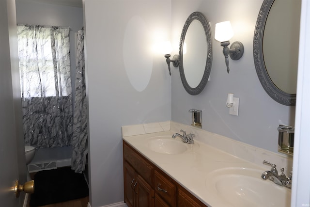12176 E 350 N, Loogootee, IN 47553 - full bath featuring toilet, a shower with curtain, a sink, and double vanity