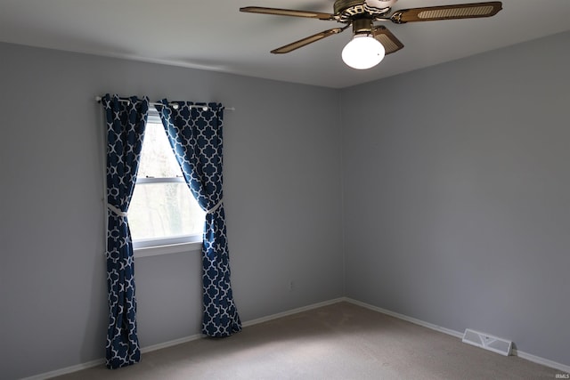 12176 E 350 N, Loogootee, IN 47553 - carpeted spare room featuring visible vents, a ceiling fan, and baseboards
