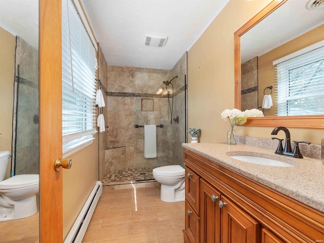 2801 W 700 S, Claypool, IN 46510 - bathroom with a baseboard radiator, toilet, visible vents, and a wealth of natural light
