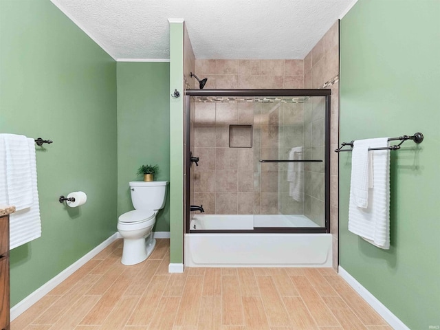 2801 W 700 S, Claypool, IN 46510 - full bath featuring baseboards, a textured ceiling, toilet, and enclosed tub / shower combo