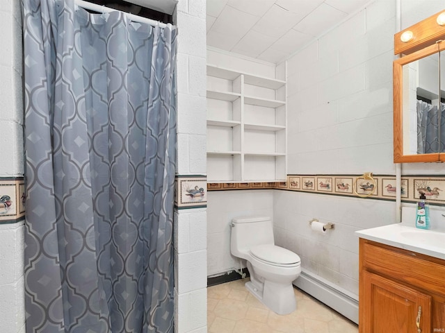2801 W 700 S, Claypool, IN 46510 - full bath with toilet, tile walls, baseboard heating, tile patterned flooring, and vanity